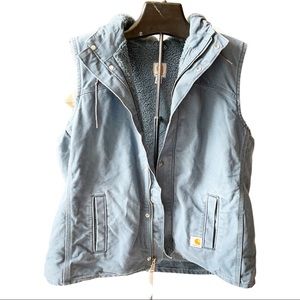Carhartt blue fleece lined zip up hooded work vest. Mid tone blue in color.